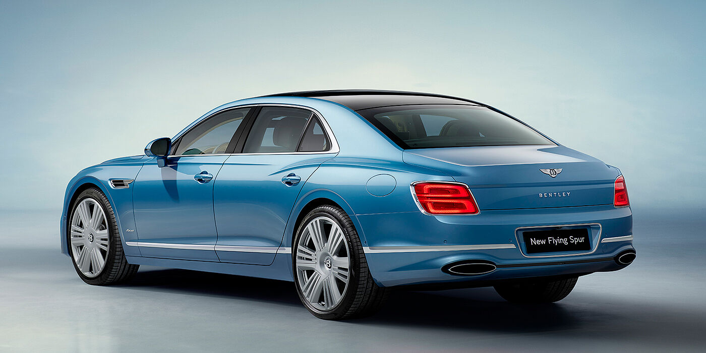 Bentley Oslo New Bentley Flying Spur Azure sedan rear view in Light windsor blue by Mulliner paint with 22 inch Azure wheels and chrome exterior details