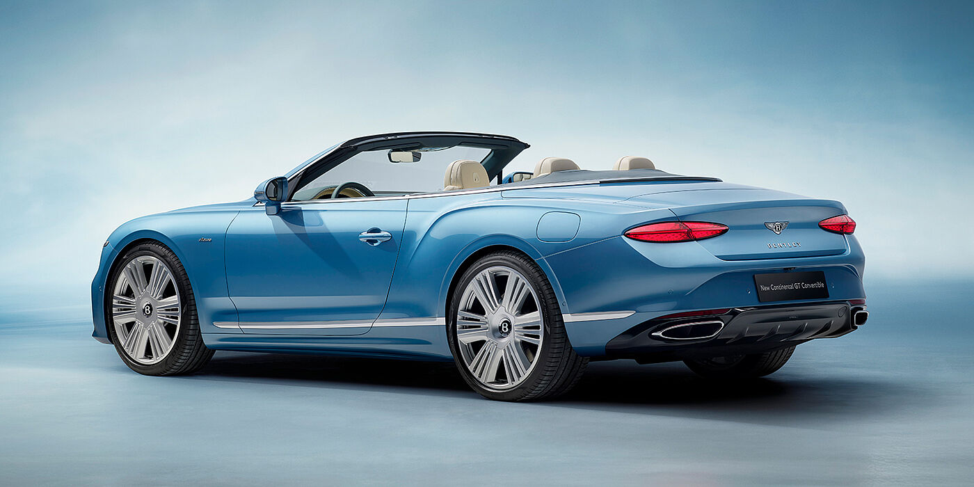 Bentley Oslo New Bentley Continental GTC Azure convertible rear view in Light Windsor blue paint with 22 inch ten spoke wheels and chrome exterior details