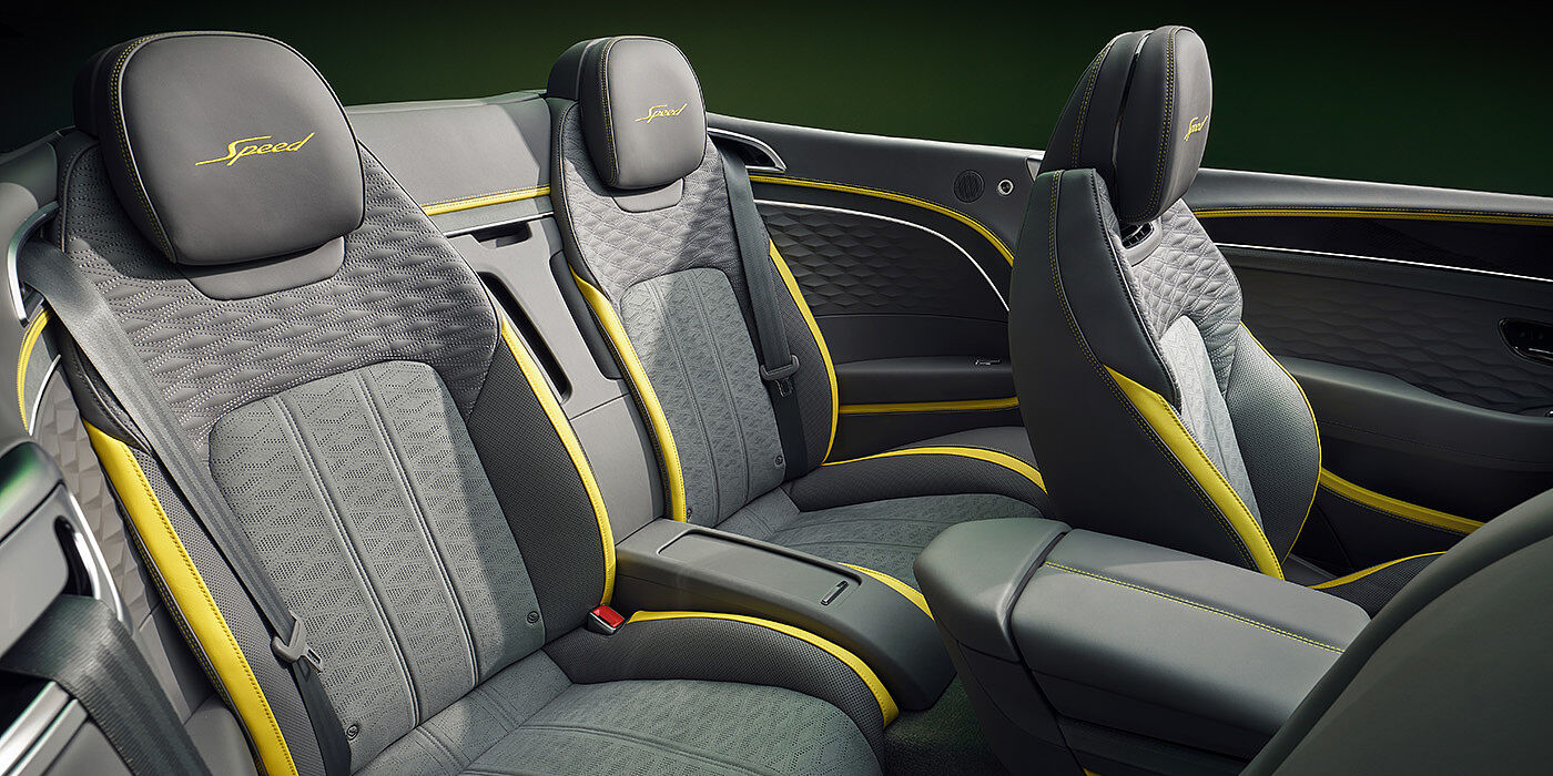 Bentley Oslo Bentley New Continental GTC Speed convertible rear interior with unique Speed colour split in Gravity Grey and Cyber Yellow hide colours, and contrast stitched headrest emblems 
