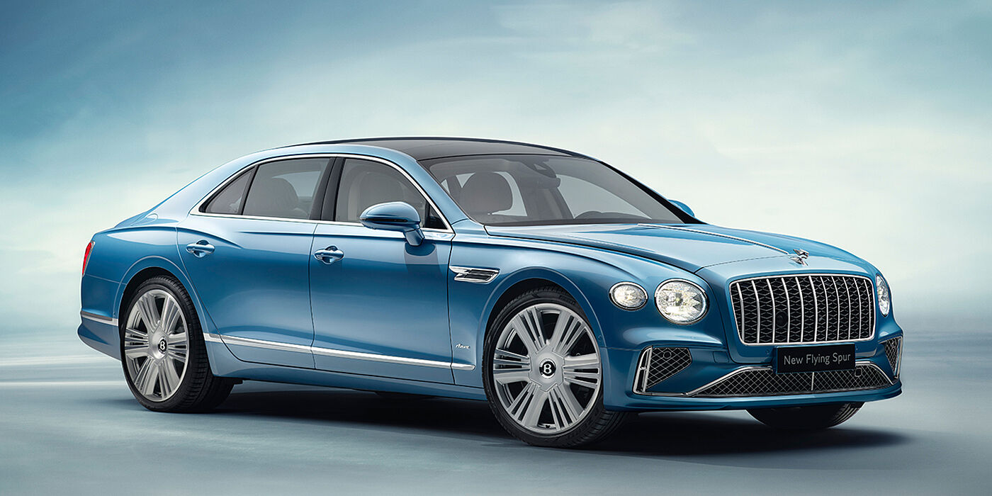 Bentley Oslo New Bentley Flying Spur Azure sedan front view in Light windsor blue by Mulliner paint with 22 inch Azure wheels and chrome exterior details